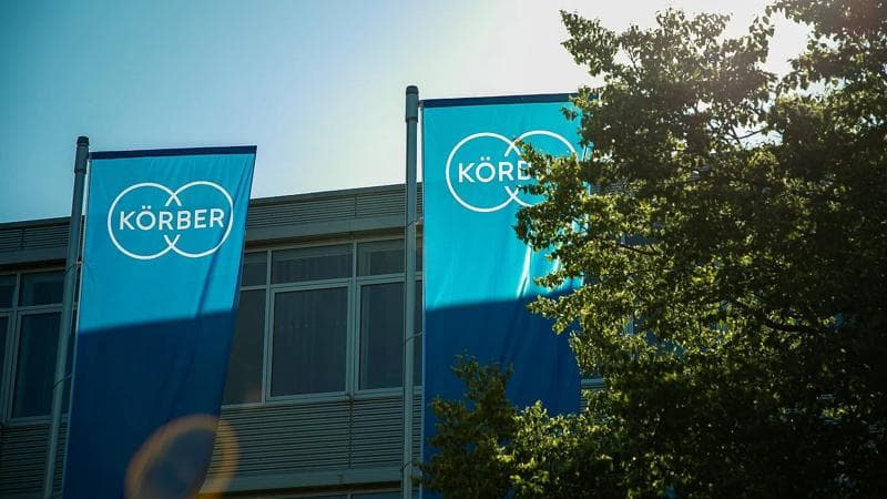 Körber's blue flags outside the environmental circle event.