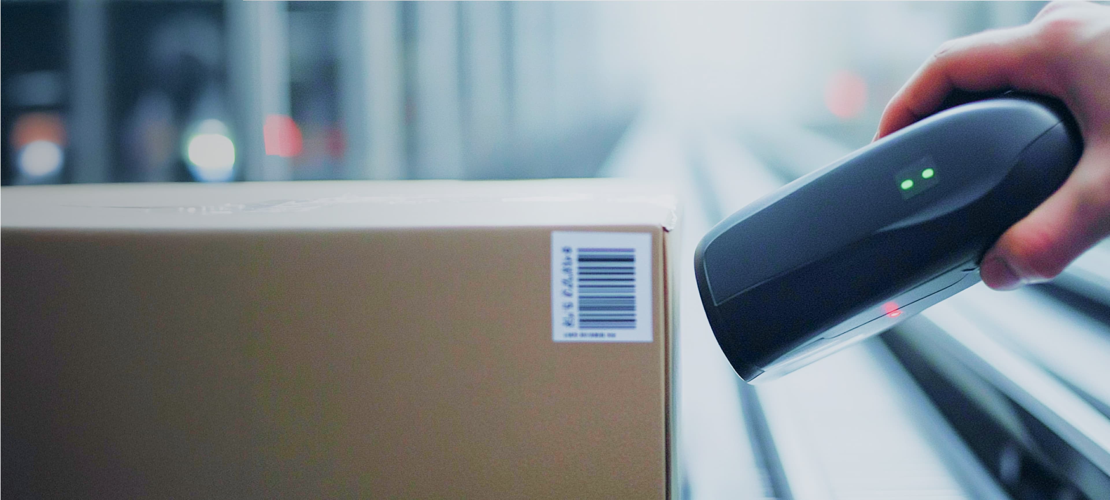 Close up shot of a hand scanning a barcode on a parcel