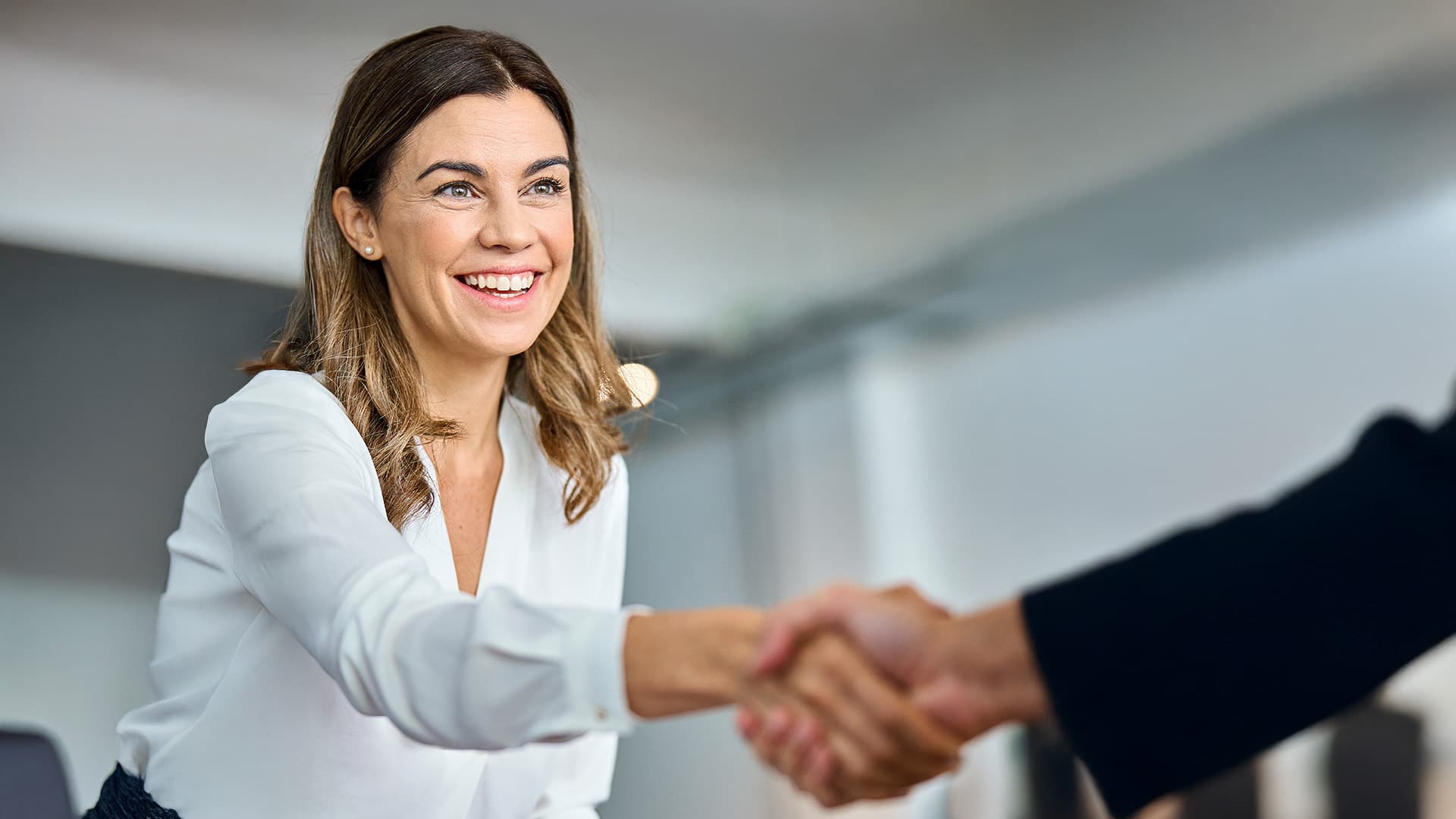 Woman shaking hands with someone