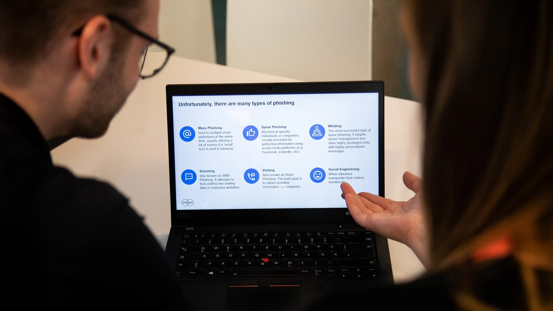 Körber's employees working on a computer screen on cybersecurity issues