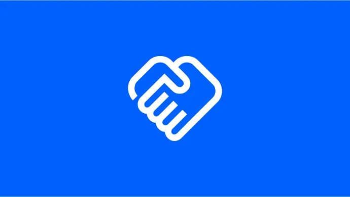 A blue and white logo with a hand grasping a heart