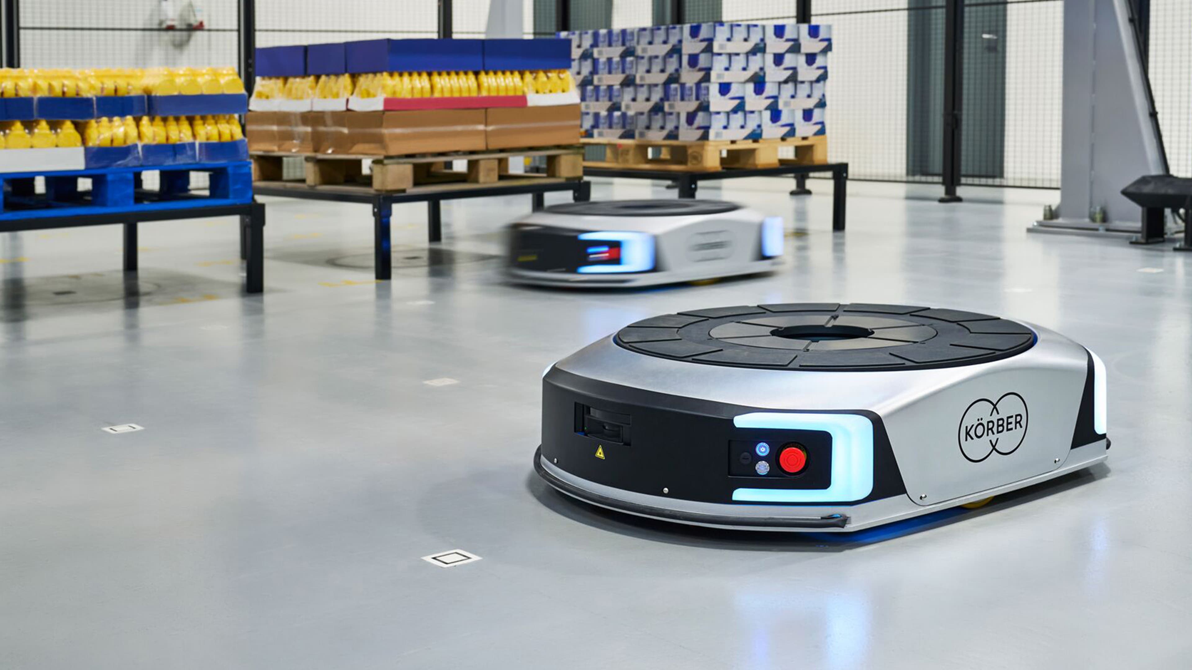 Two AMR robots in a warehouse