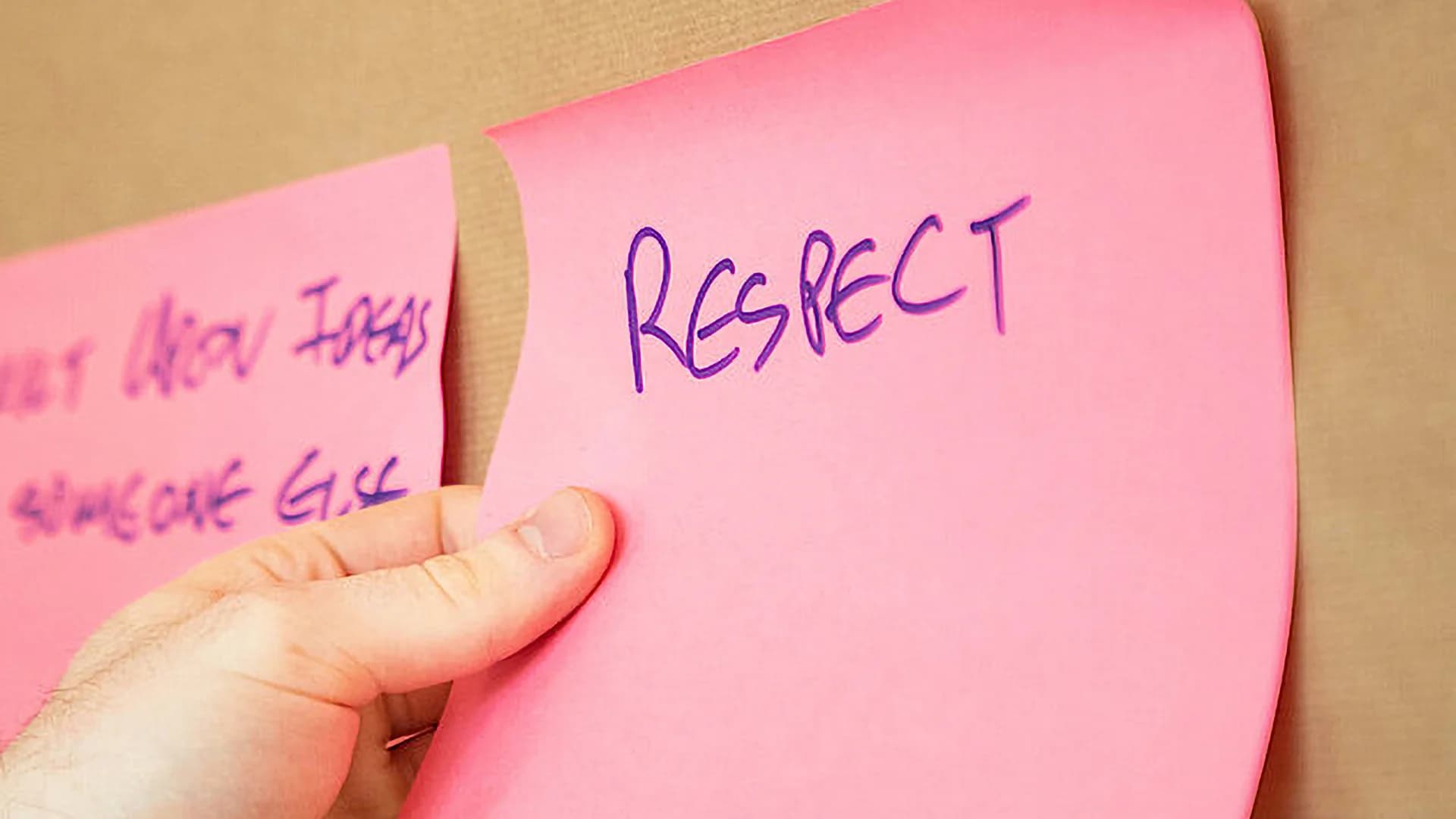 Post-it note with the word respect written in it.