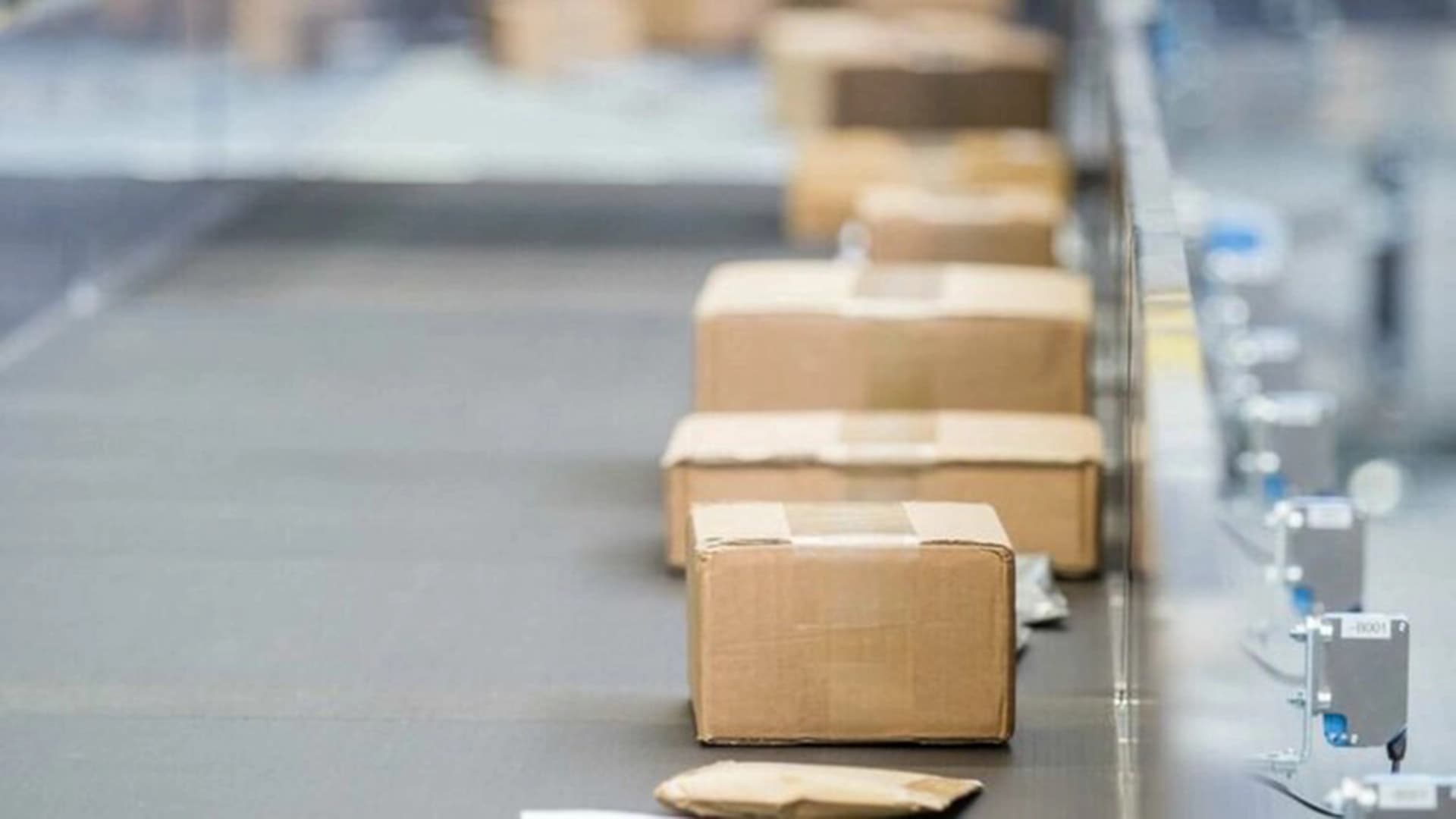 Boxes in a machine belt being sorted in an operational center