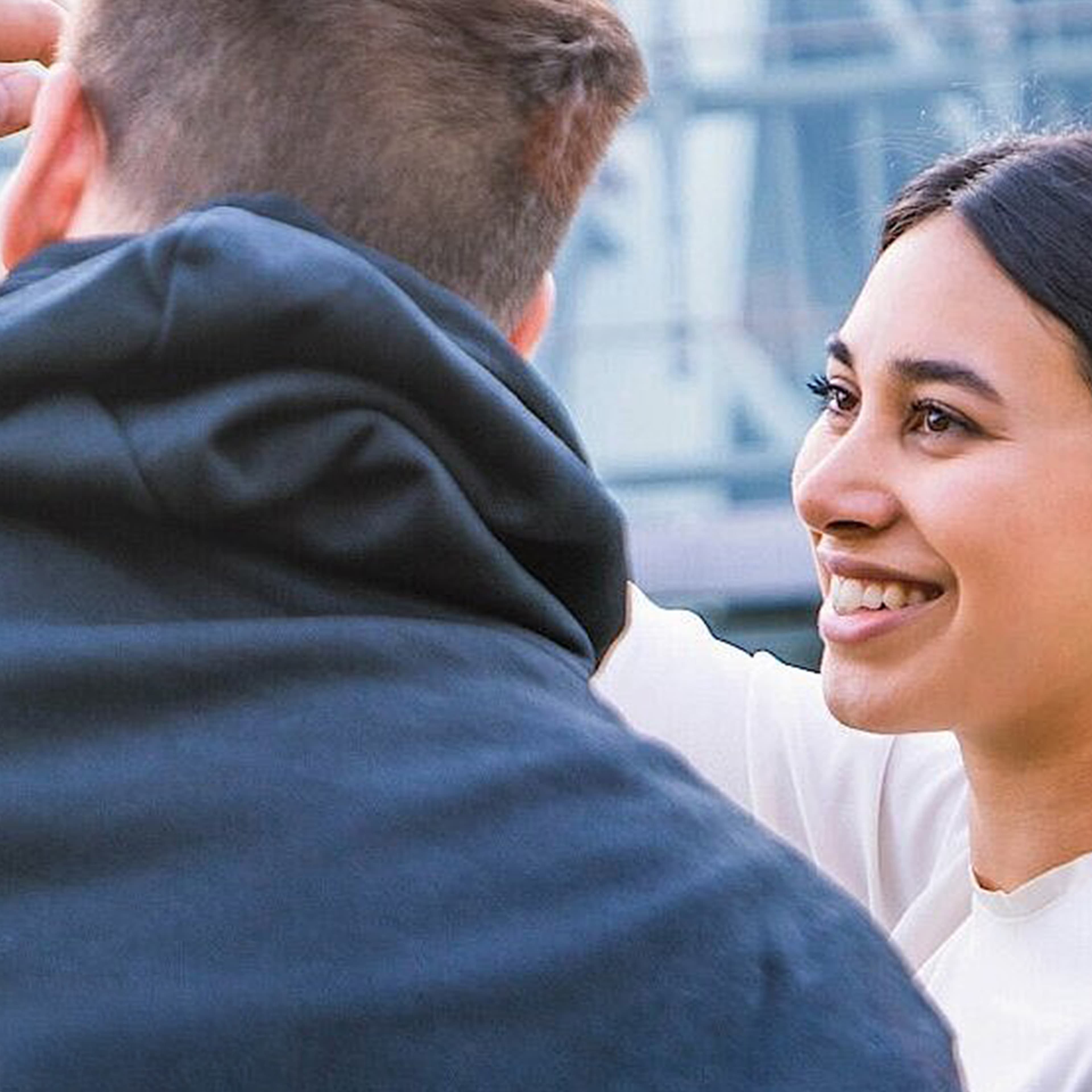 Woman smiling next to a man