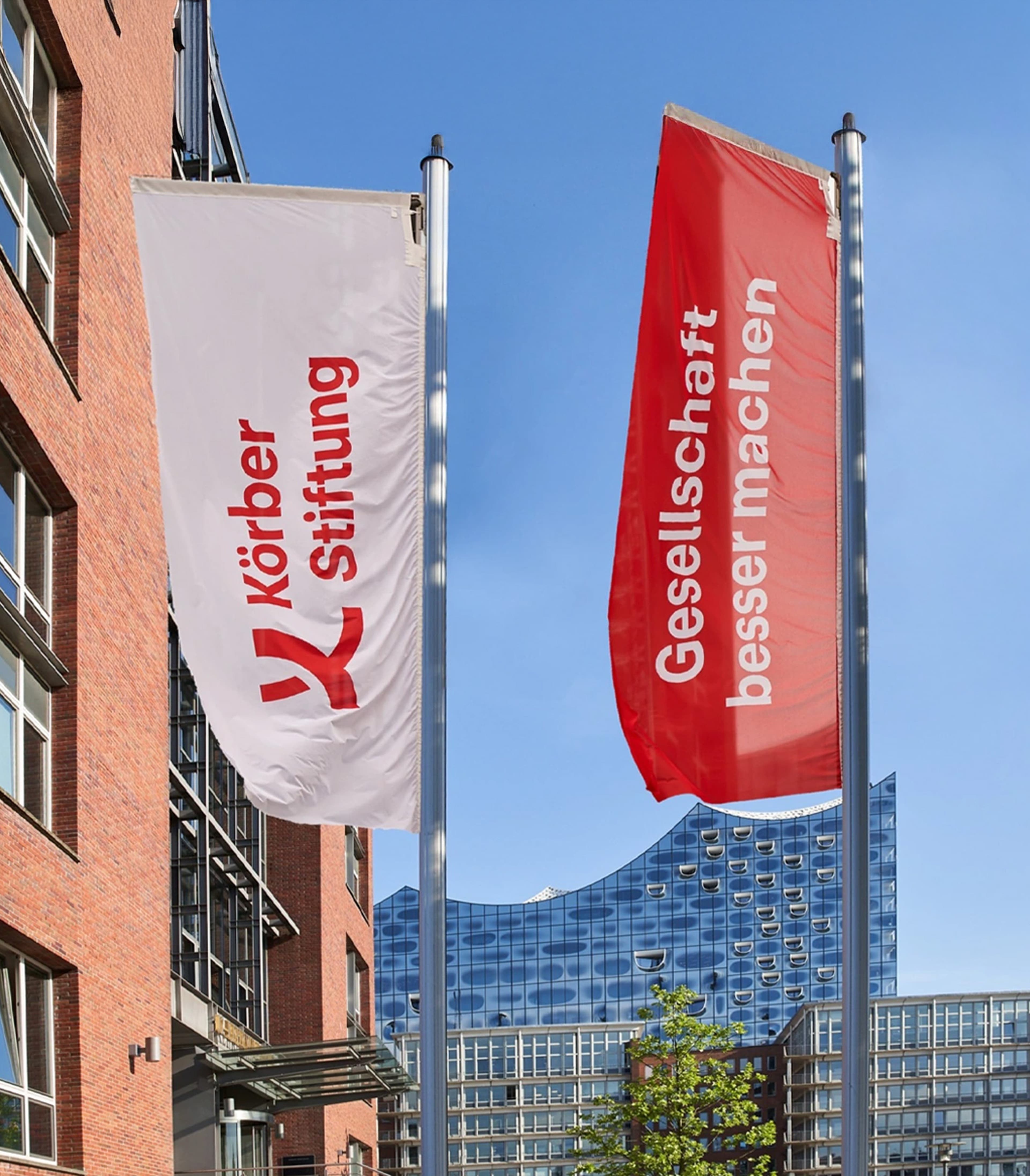 Two flags with Körber Stiftung branding