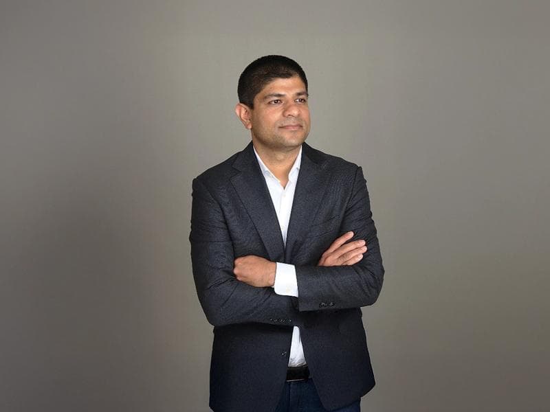 Ananta Islam on a blue background