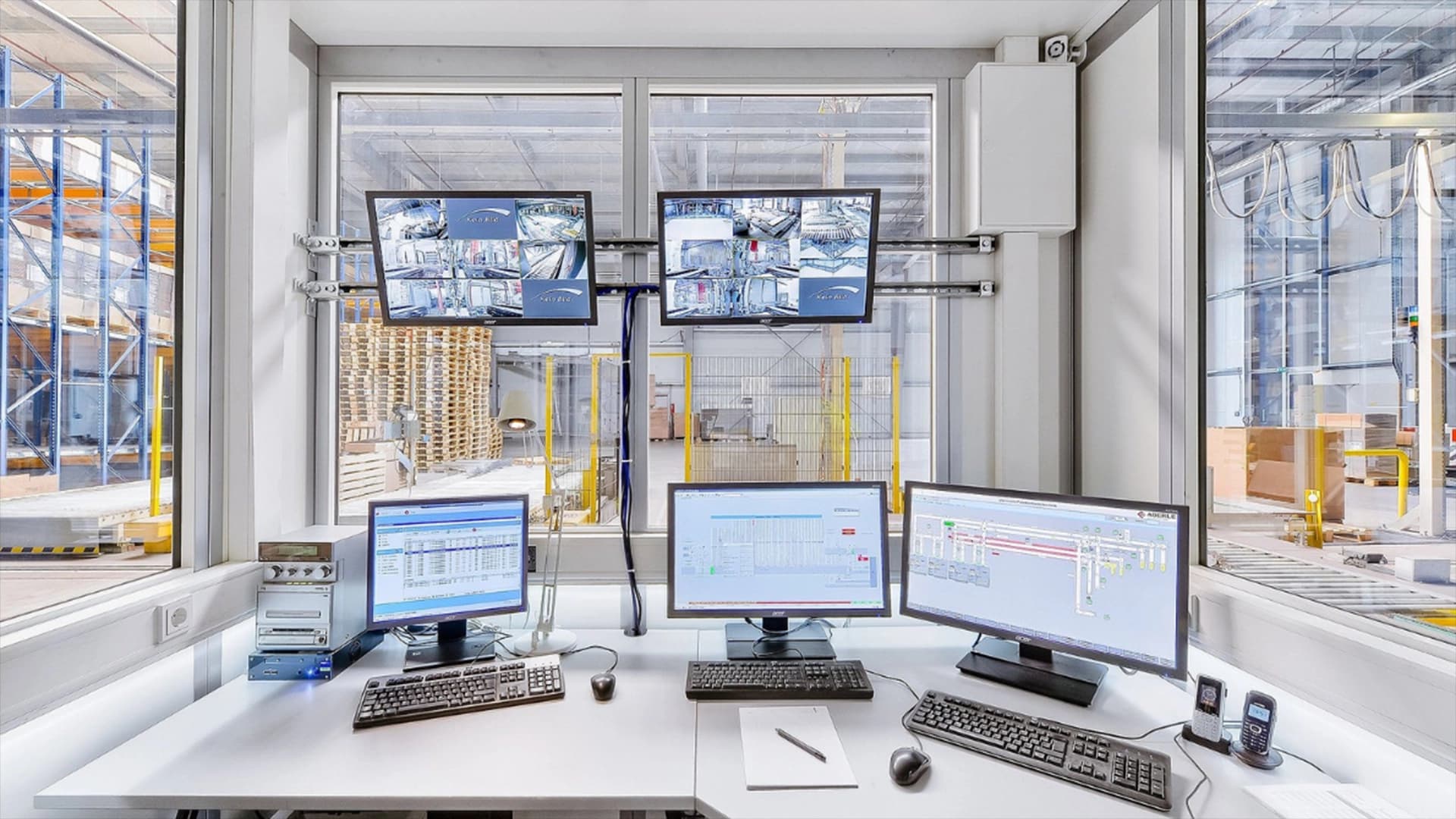 Control room inside a warehouse with Warehouse Control System (WCS).