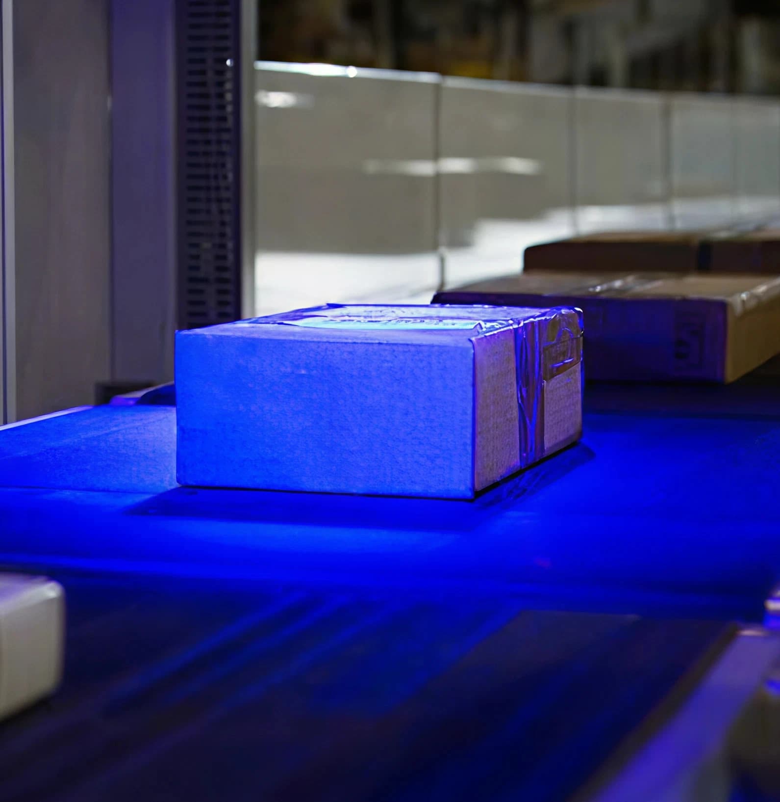 Picture of a conveyor moving boxed.