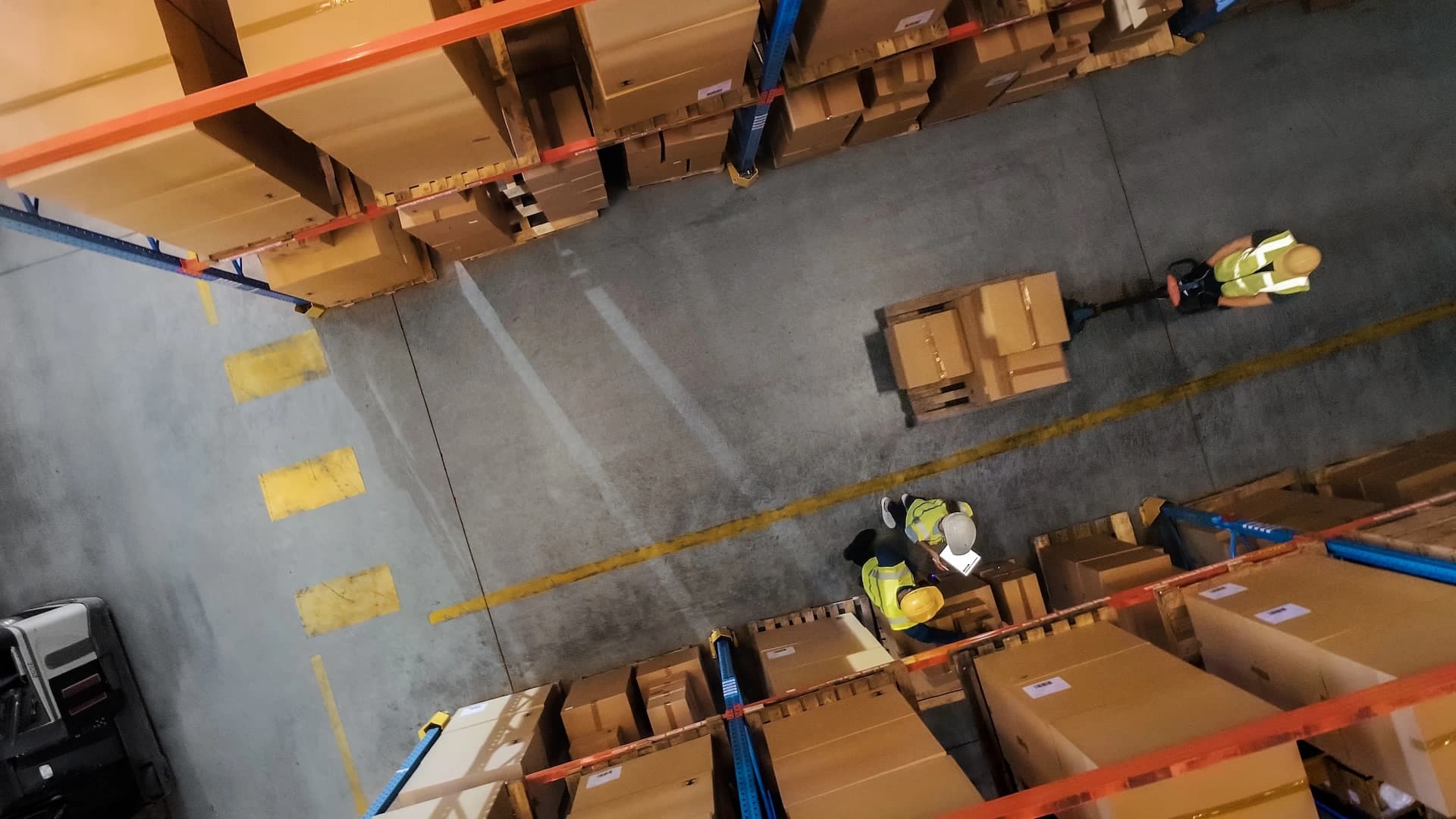 a warehouse full of boxes with people working on a receiving and distribution system