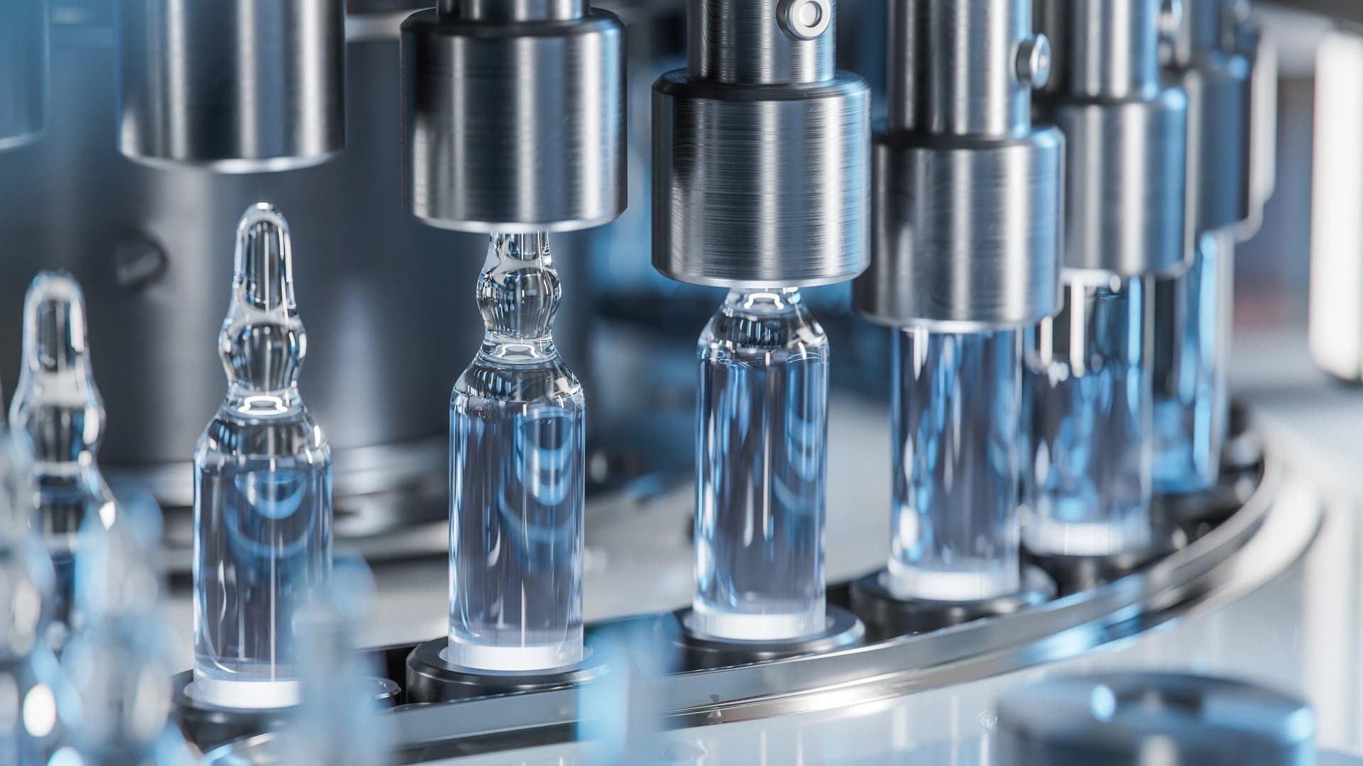 Picture of vials being inspected in a machine.