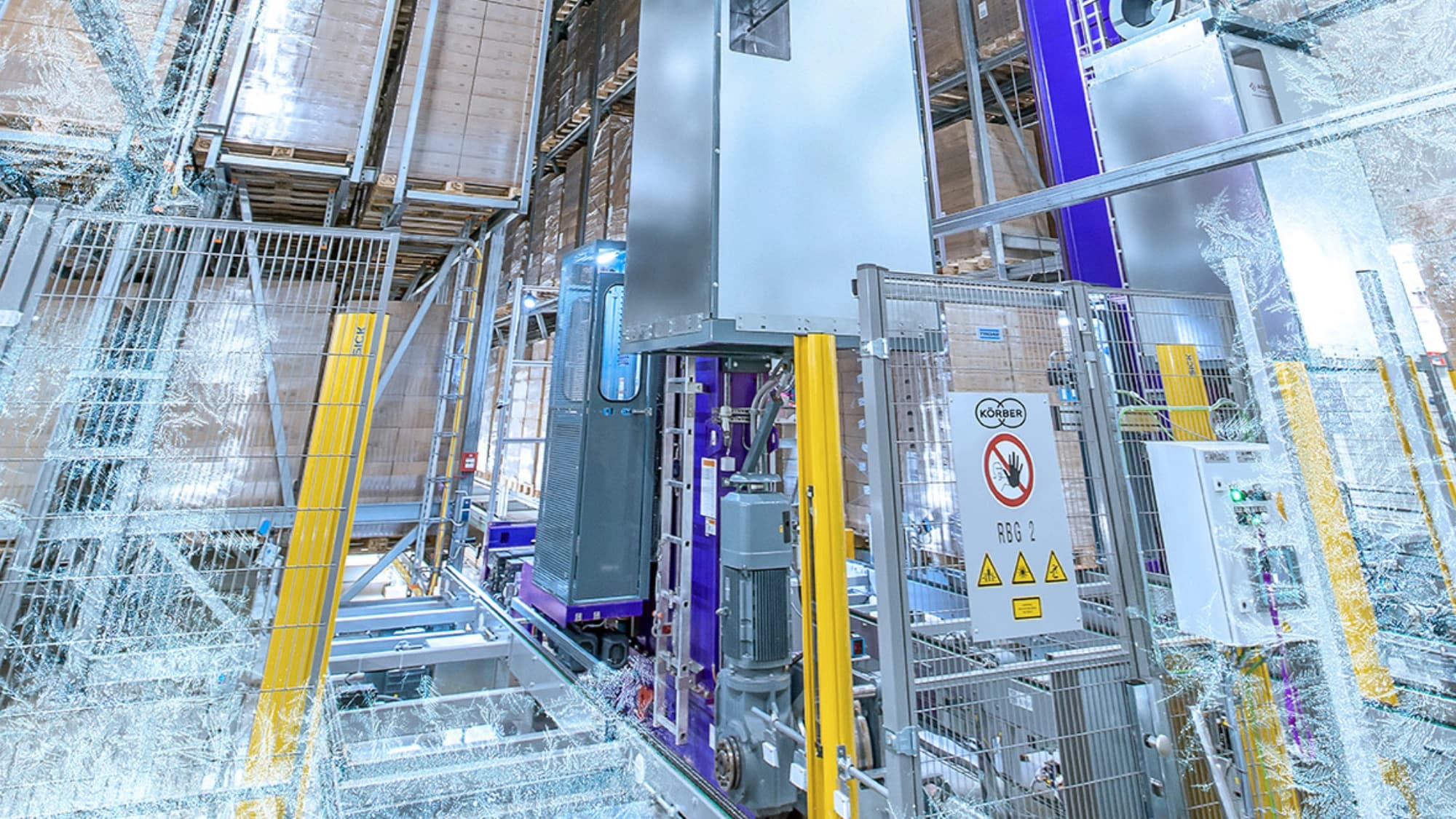 a man working on pallets inside a warehouse