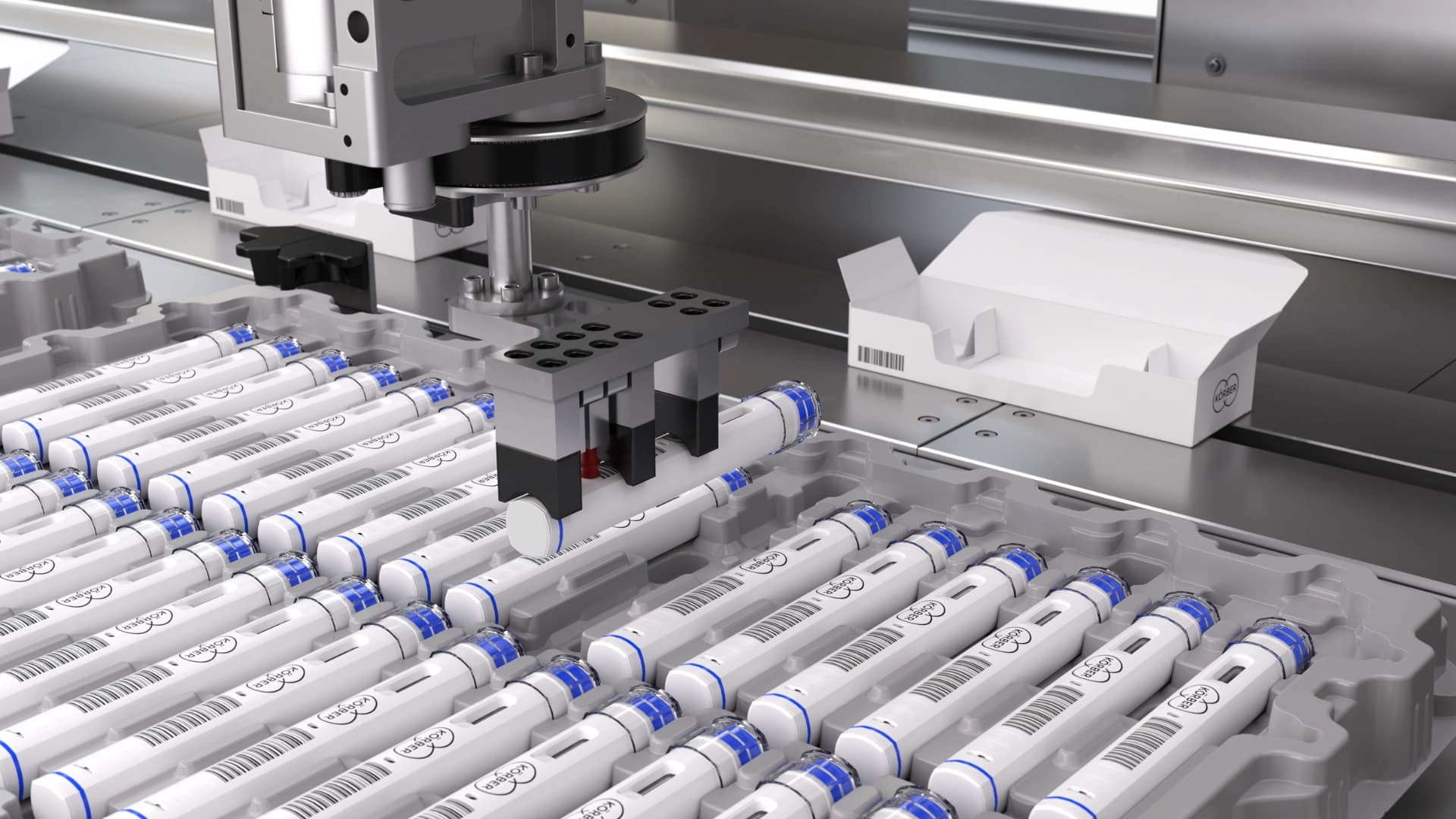 Picture of a parenteral packaging machine where autoinjectors being placed inside a box.