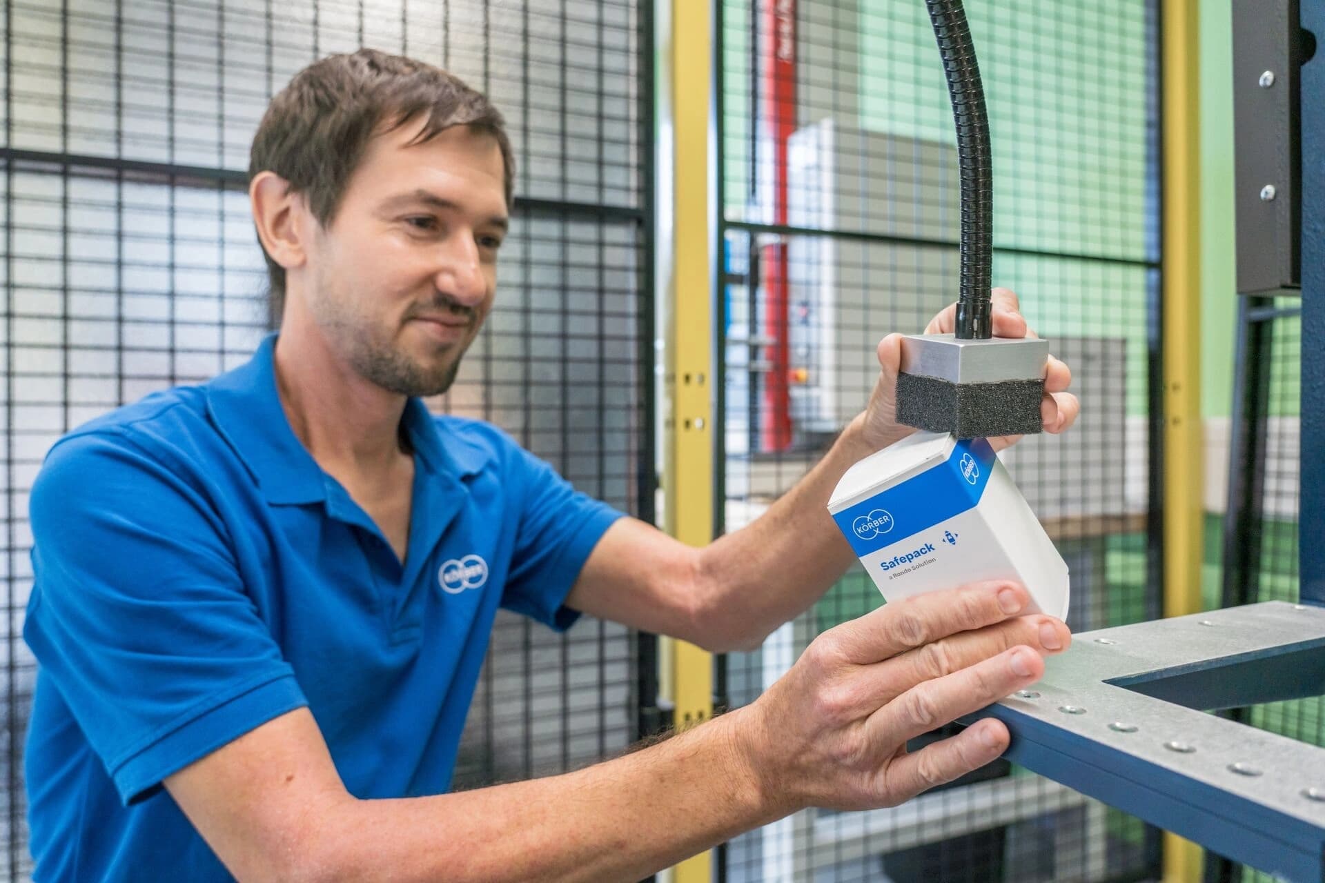 a Körber employee working on packaging and inspection evaluation