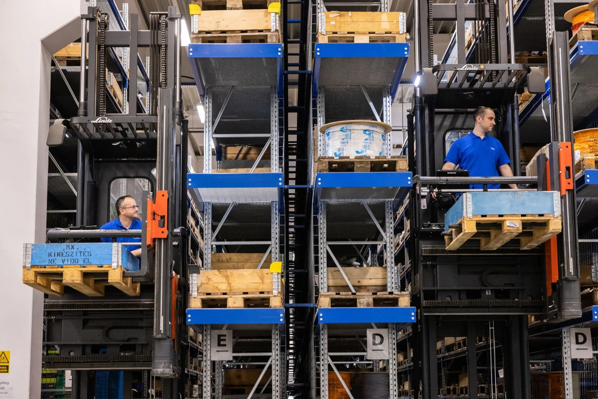 two korber workers in a storage and retrieval system