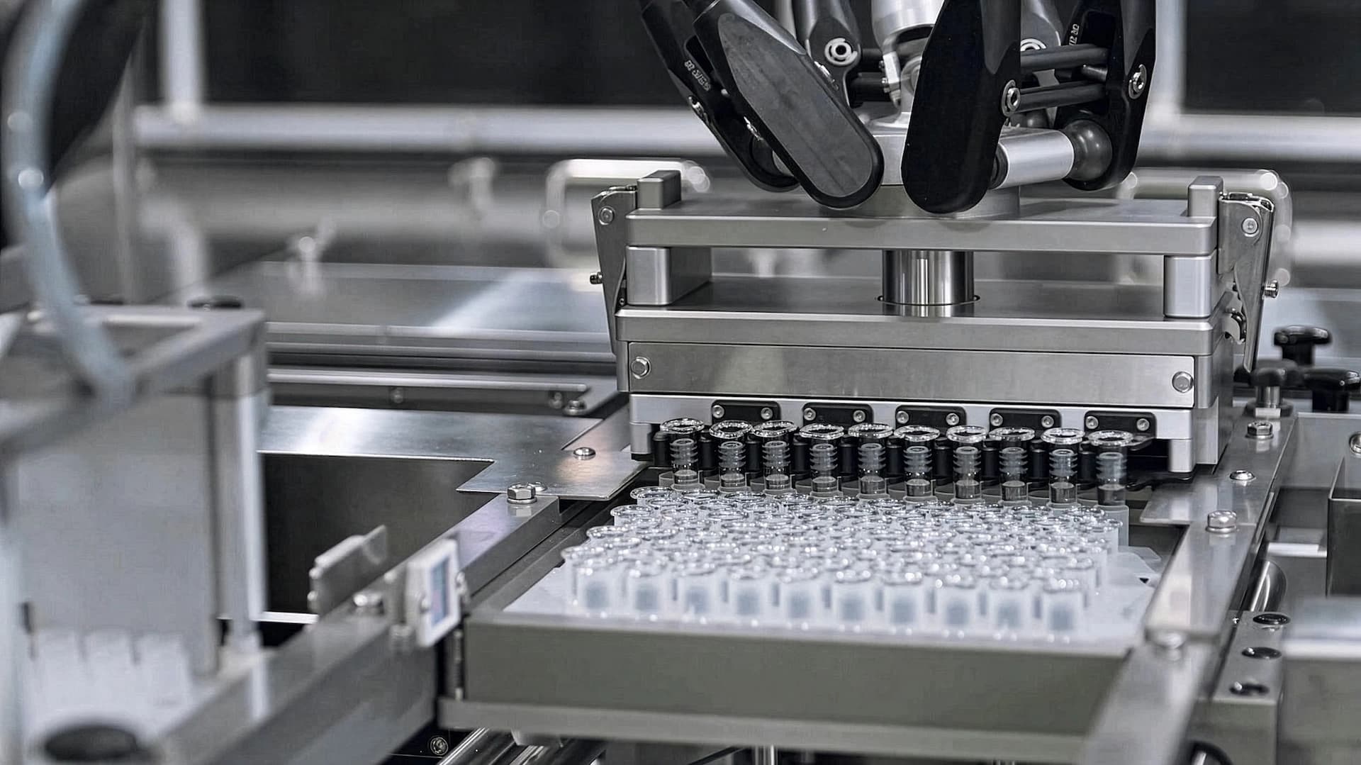 a bunch of syringes in a handling system