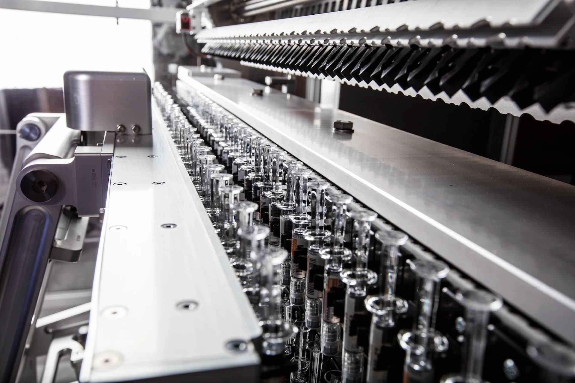 close up of syringes on pharma handling equipment