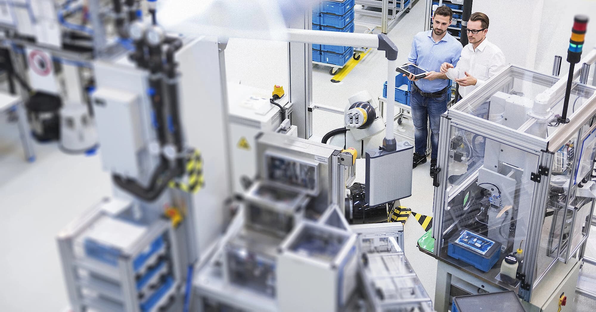 two Körber employees in a manufacturing environment