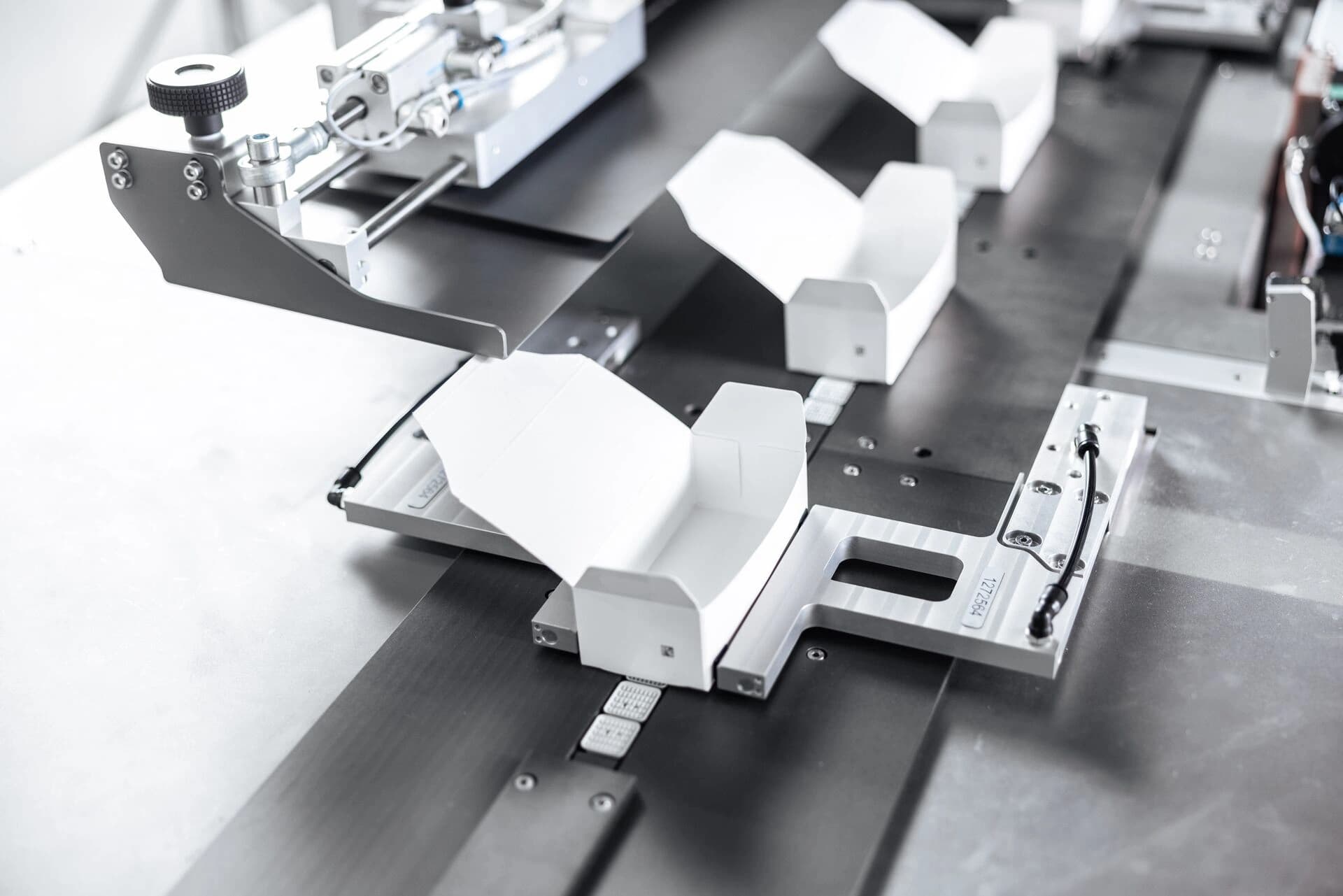 Cartons being assembled in a line machine.