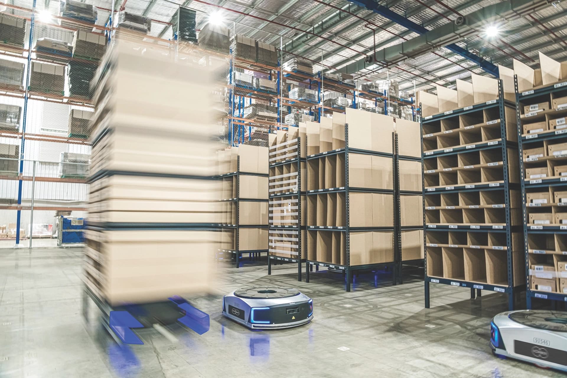 Automated mobile robot in a warehouse.