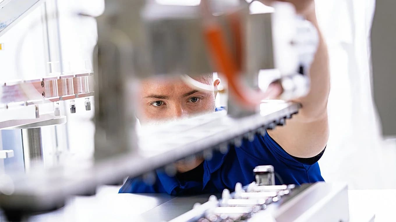 Close up of someone inspecting an accumulator.