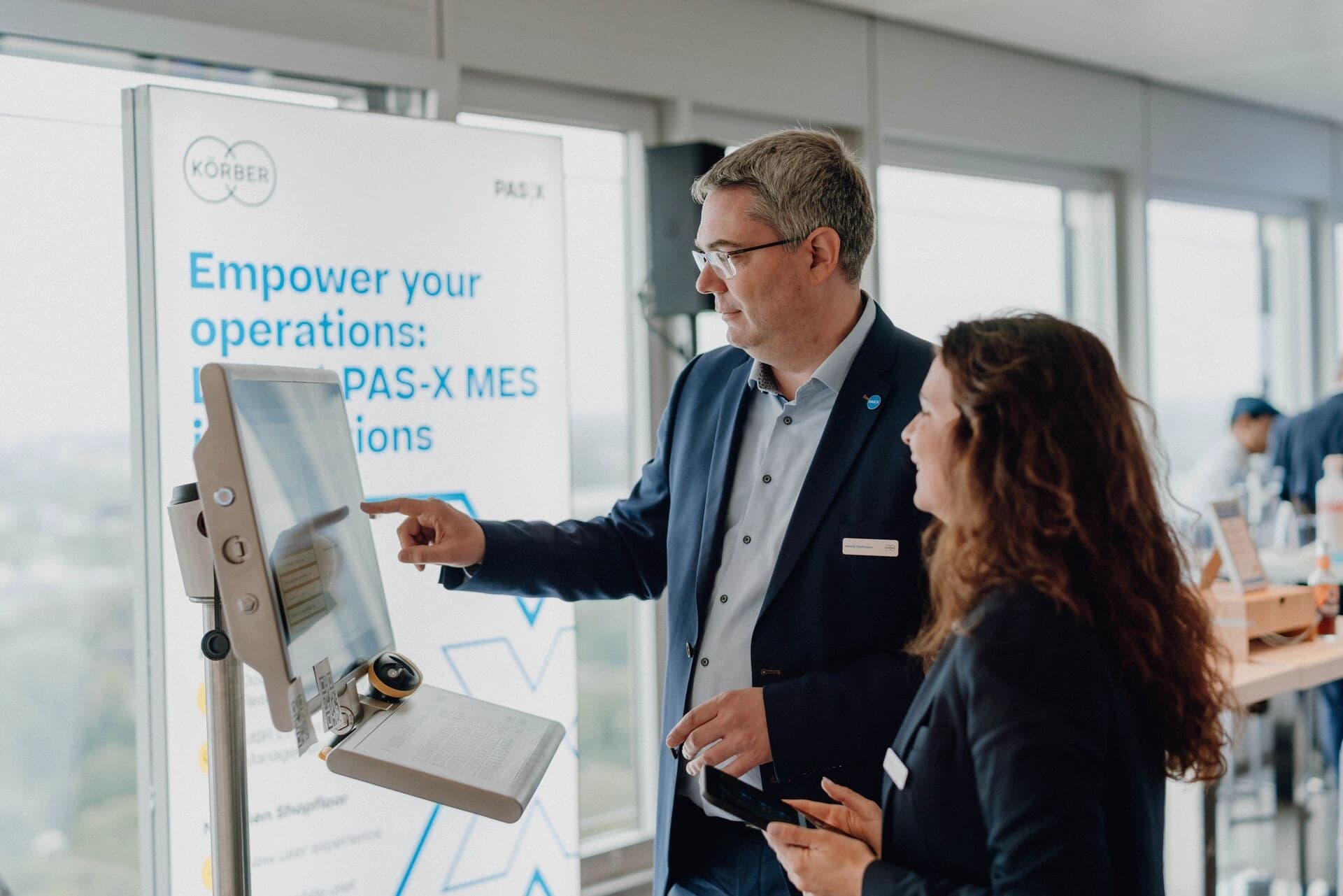 a man and a woman focused on PAS-X software
