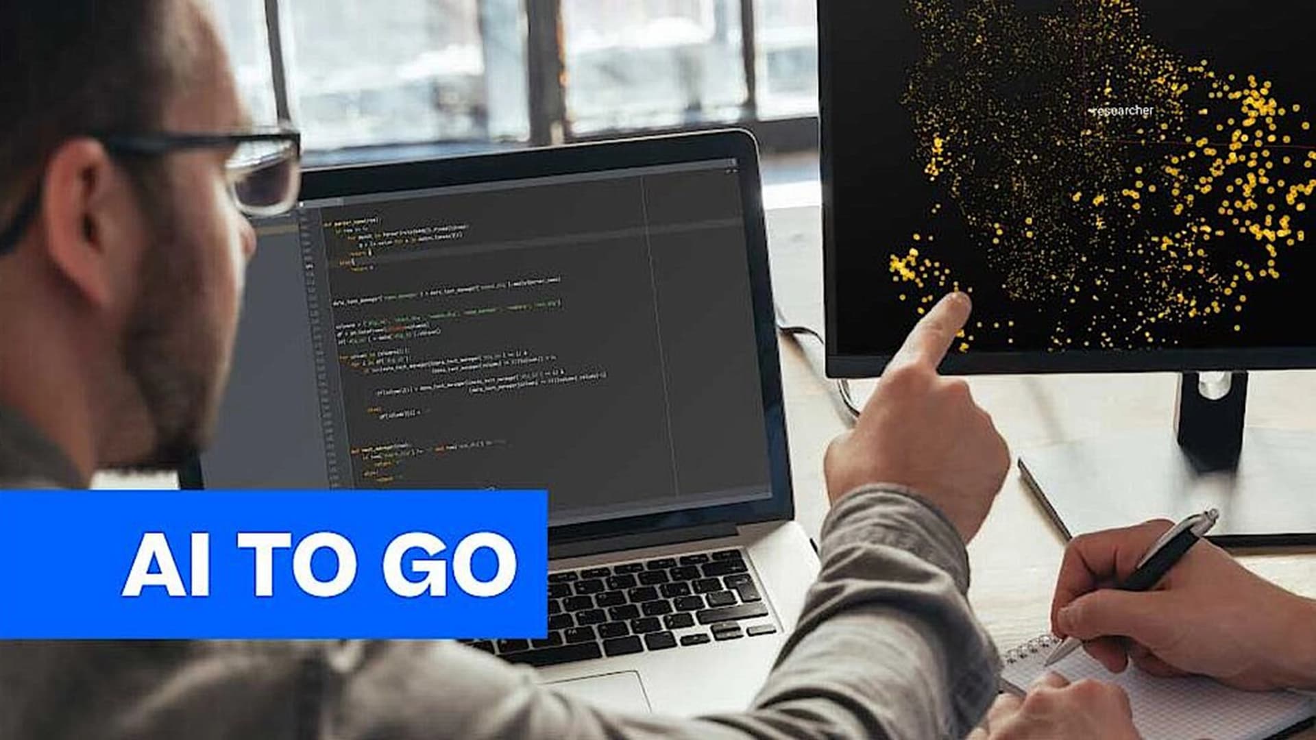 Two data analysts checking data behavior on a computer screen.