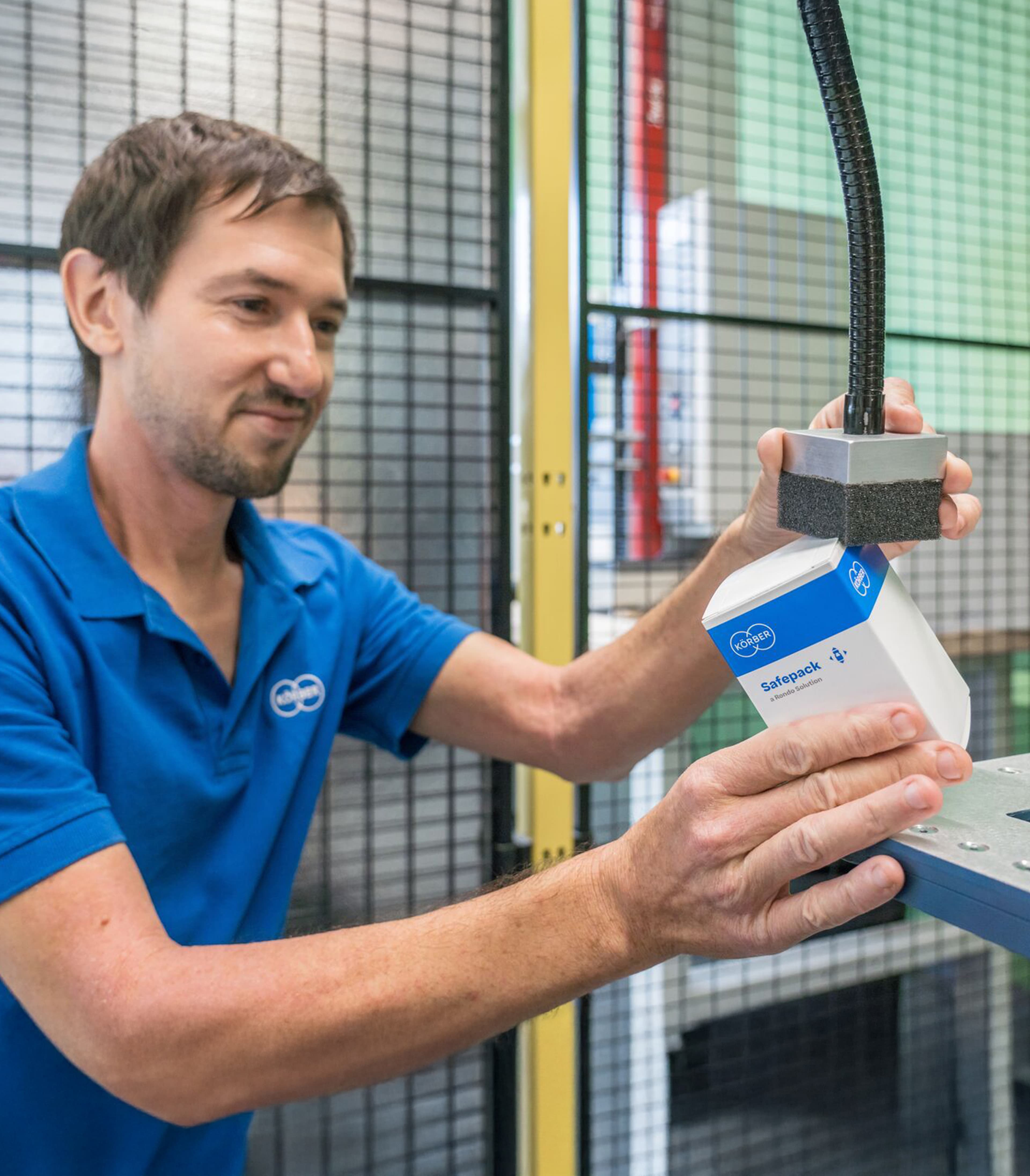 Körber employee testing packaging