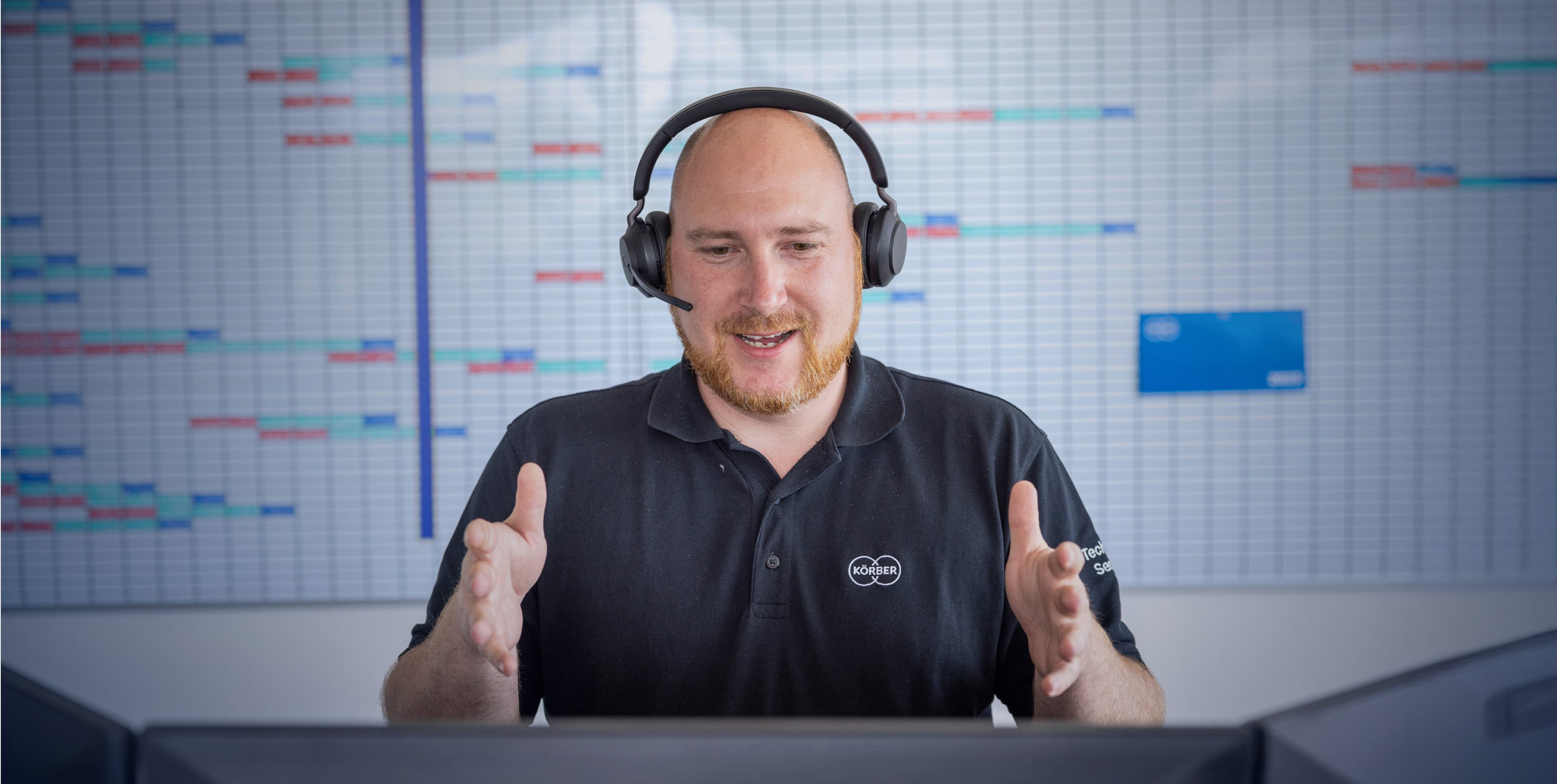 Körber employee talking on a headset